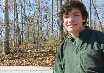 Evan at the Whispering Woods Braille Trail.