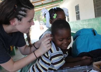 Grace in Haiti, creating molds for Mackenlay's hearing aid.